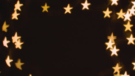 Background-Of-Christmas-Lights-In-The-Shape-Of-Stars-With-Copy-Space